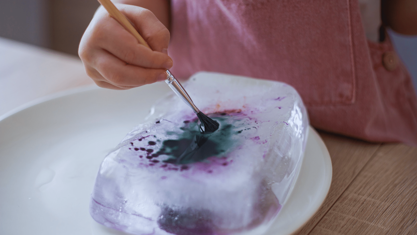 Toddler Painting Block of Ice